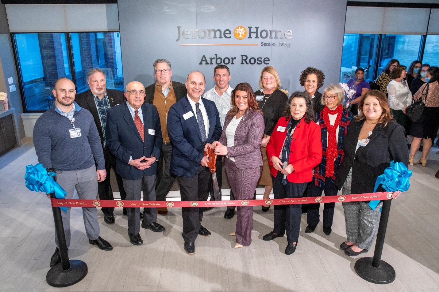 From the back left are: City of New Britain representative, Gerry Frank, architect, Bechtel Frank Erickson, Jeff Palmer, C. E. Floyd; Lori Toombs, regional director assisted livings, Hartford HealthCare; and Alyssa Pagan, executive director, Arbor Rose.  From the front left are: Noah Morgan, project manager, Hartford HealthCare;Harry Mazadoorian, trustee, Jerome Home; Dan Daigle, trustee, Jerome Home; Erin Stewart, mayor of New Britain; Dr. Marie Gustin, trustee, Jerome Home; Brenda Manning, wife of former trustee, Jerome Home; and Tina Richardson, executive director, Jerome Home.